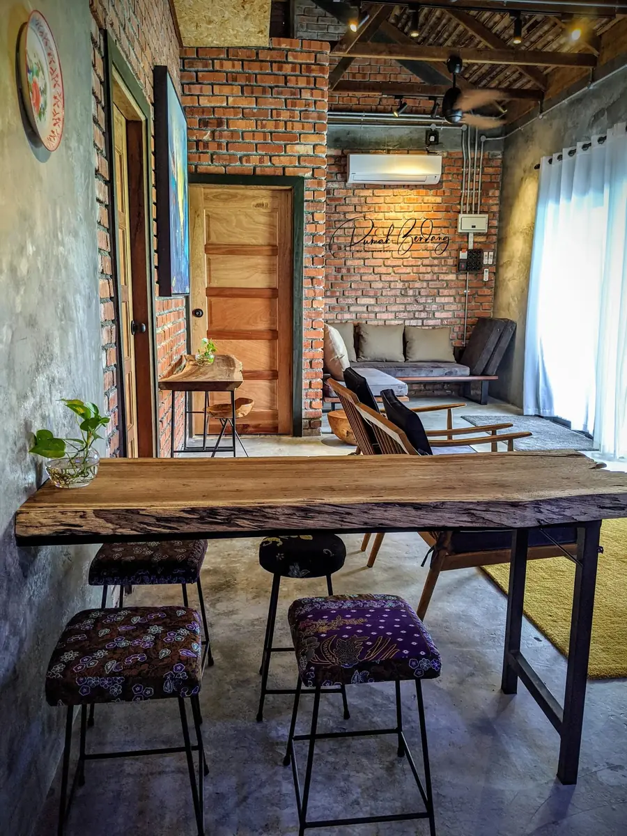 Live-edge bar table with batik-upholstered stools