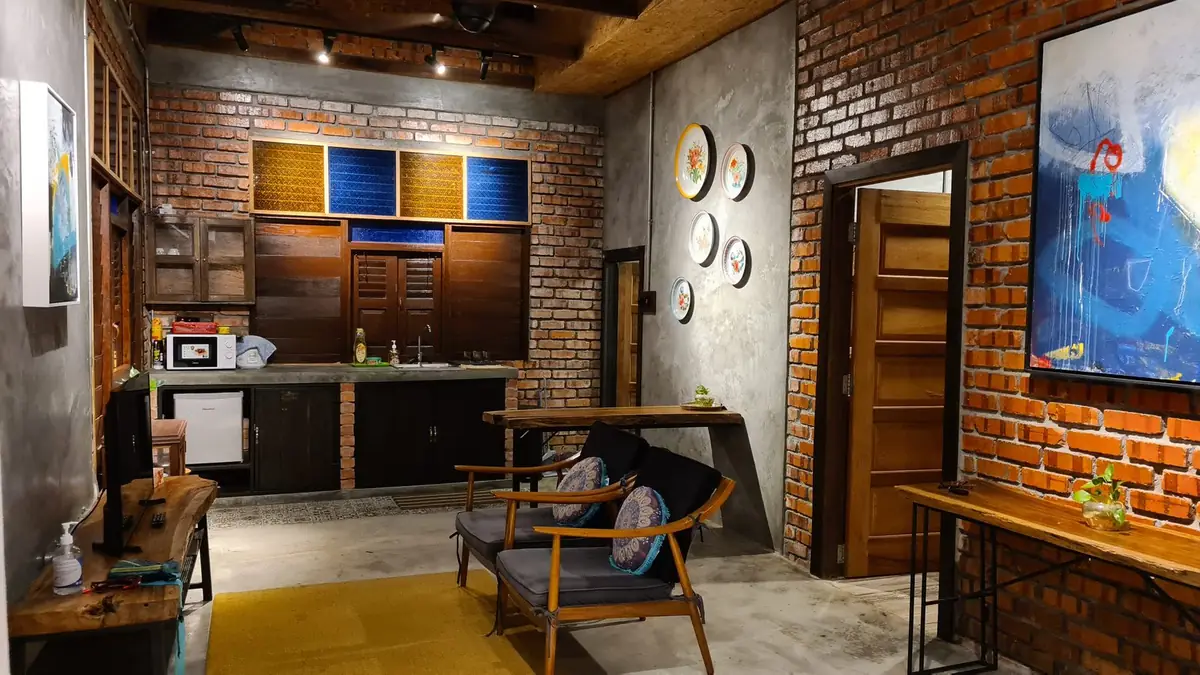 Kitchenette with reclaimed timber cabinets and vintage stained glass panels