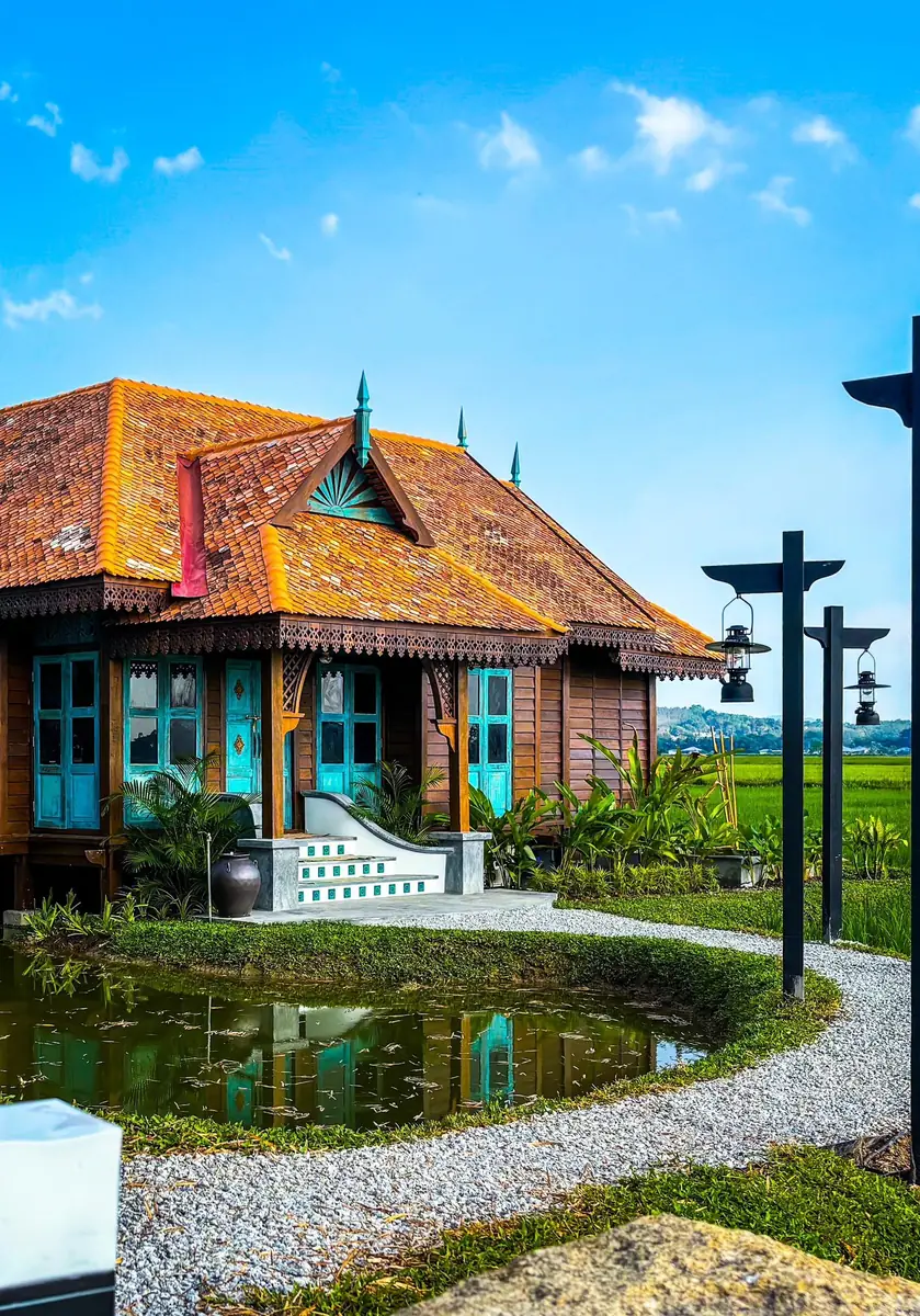 Turquoise timber porch of Rumah Uda, a reassembled traditional Malay house