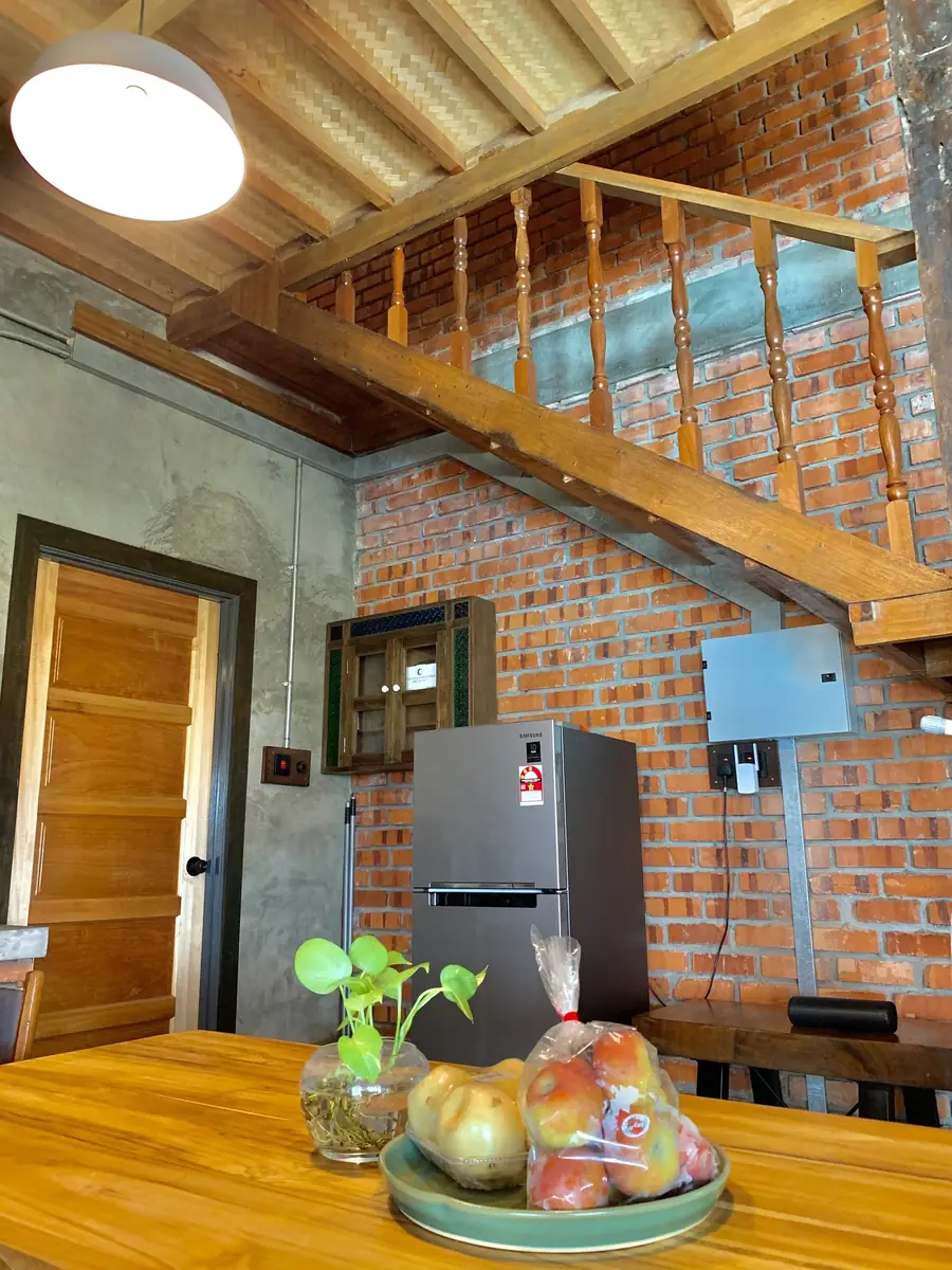 Kitchen and fridge beneath the timber staircase