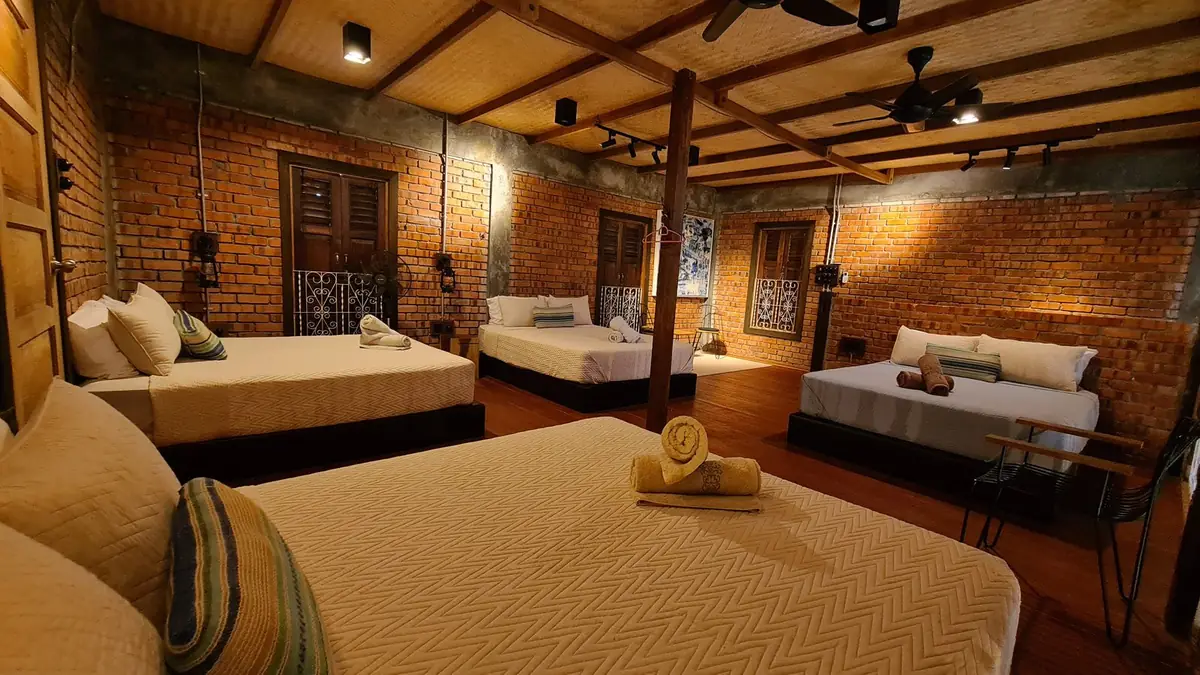 Loft beds in warm evening light with lantern wall lamps
