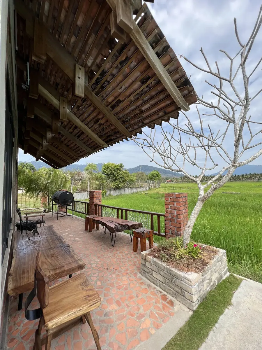 Verandah with BBQ drum overlooking the padi fields